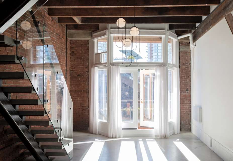 Large, Unfurnished, Modern, Brick, Beam and Concrete Loft with 2 Balconies